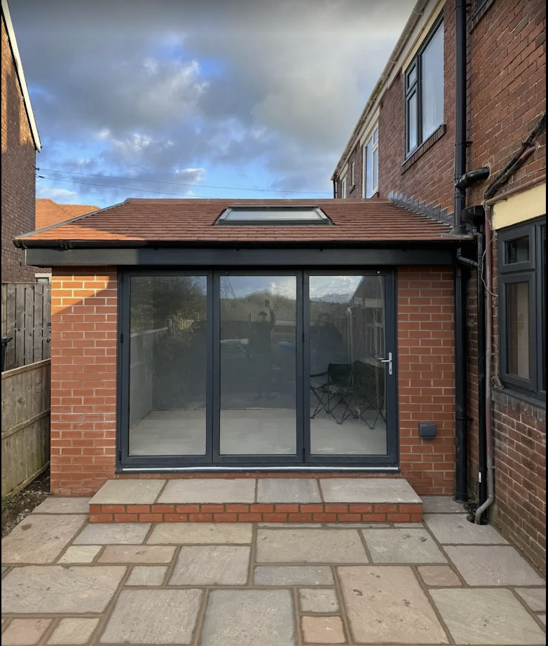 Single storey rear house extension with bi-fold doors and tiled roof
